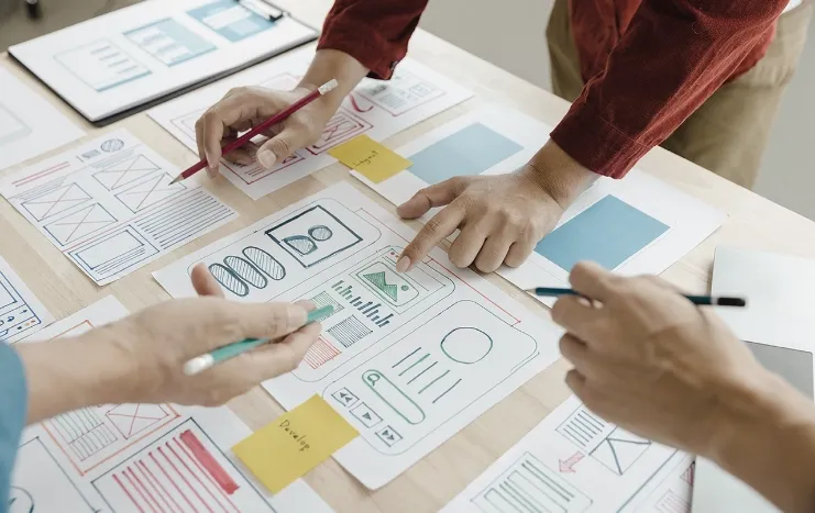 Designers collaborating on user research and prototypes