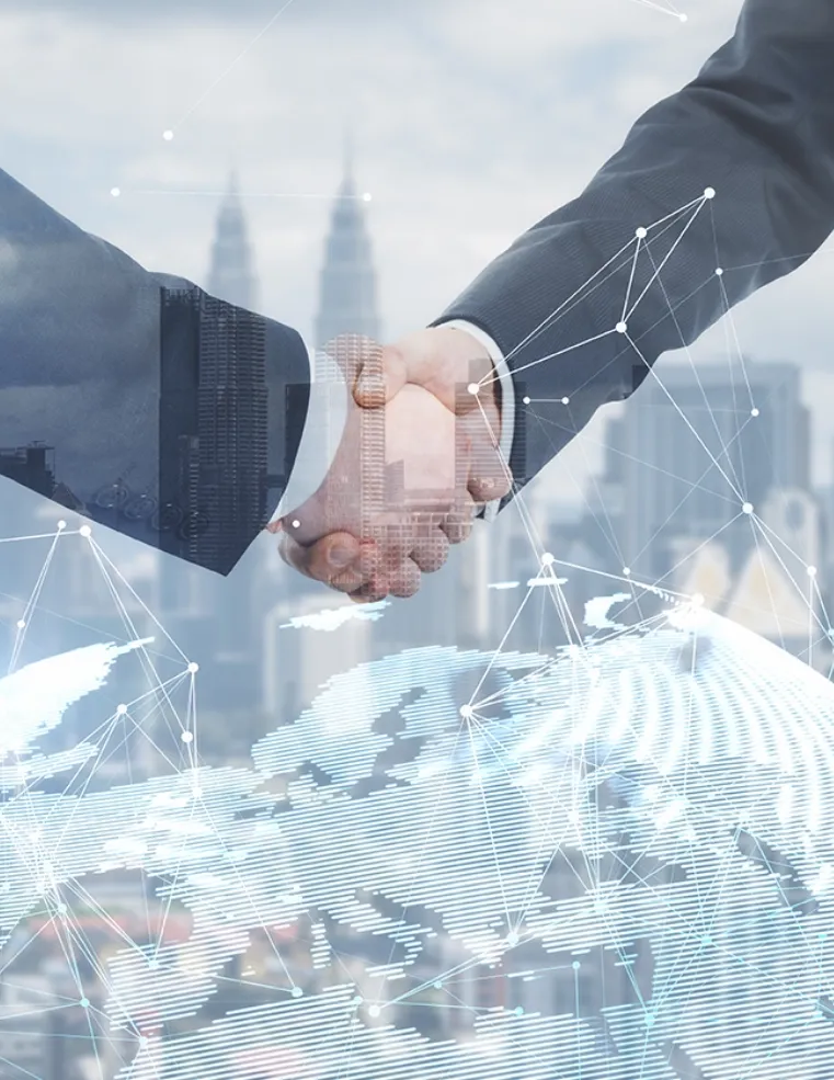 Two business professionals shaking hands with a digital network overlay