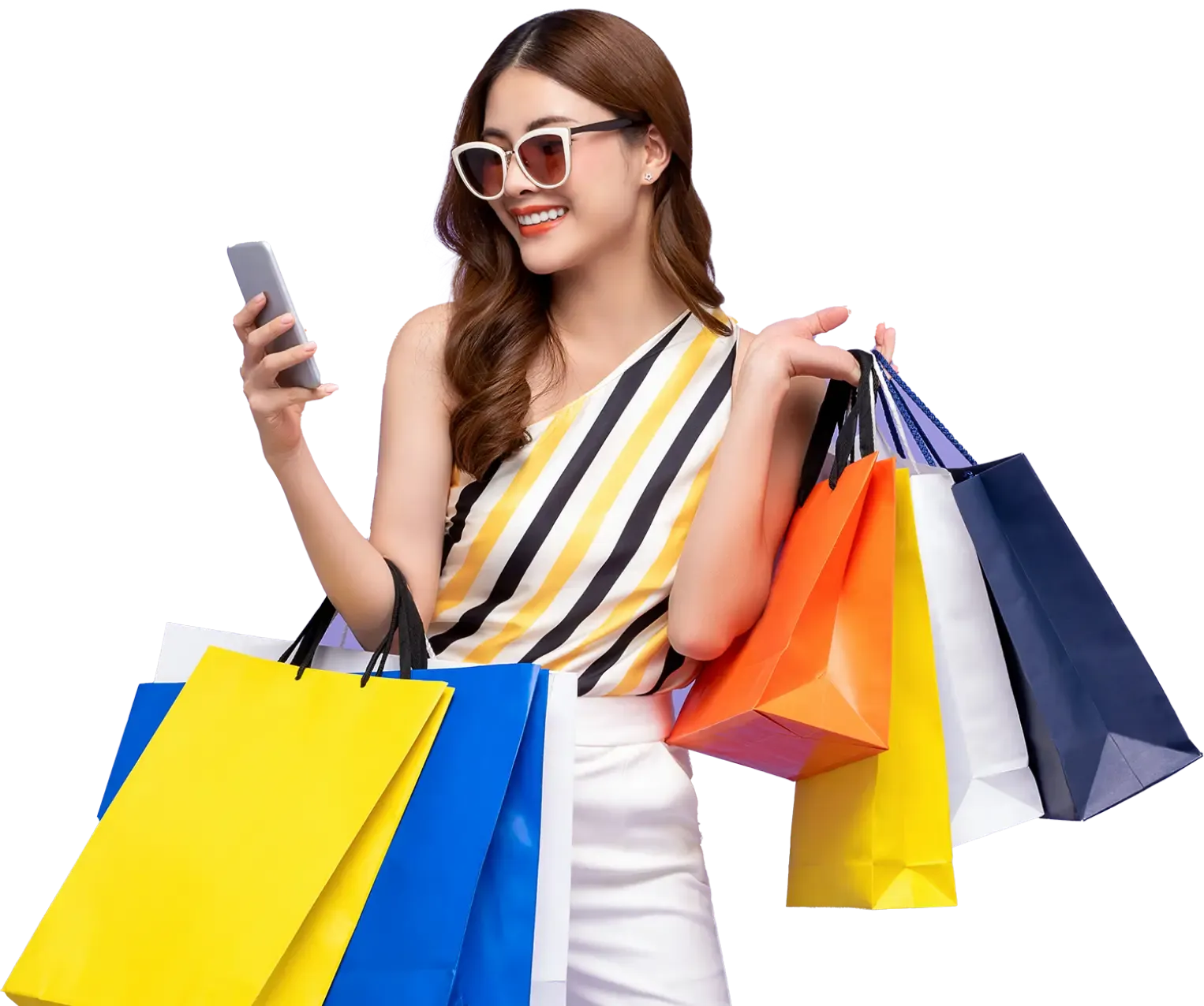 Happy woman holding multiple colorful shopping bags and using a smartphone, reflecting Trinergy’s commitment to enhancing customer experience through digital innovation.