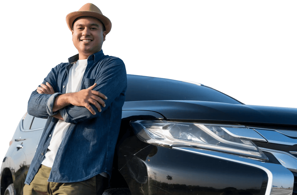 Smiling man confidently leaning on a black car, showcasing Trinergy’s customer-focused auto transport and digital service solutions.